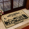 RV camping doormat styled inside a doorway with campsite artwork, mountains, pine trees, and campfire scene