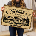 Camping doormat held indoors, displaying an RV by the mountains with pine trees, stars, and camp chairs