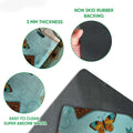 Close detail of the camping doormat surface and black rubber backing with the RV artwork visible