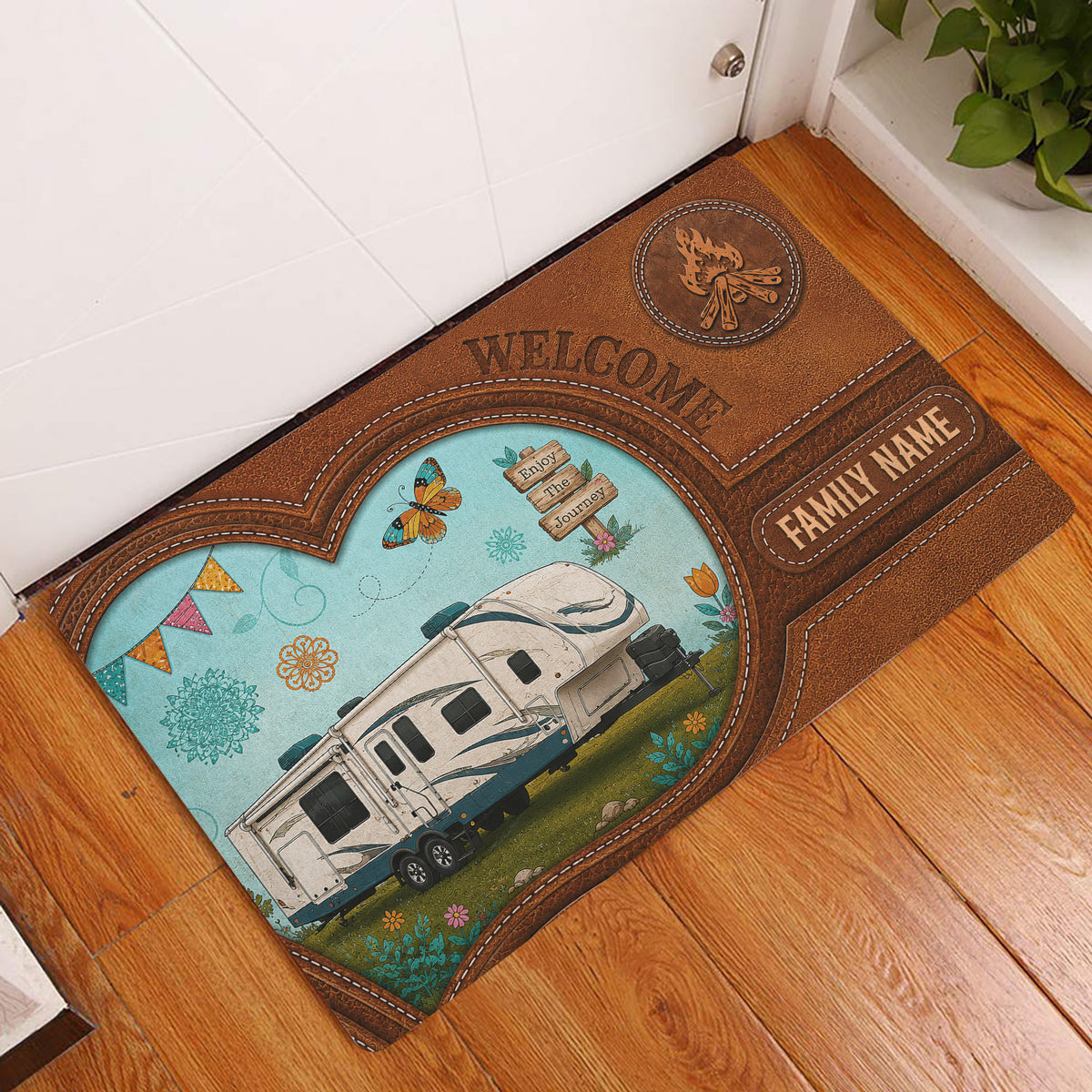 Camping entryway rug displayed by a door with a travel trailer, campfire, flowers, and rustic brown border