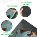 Close-up feature view showing the printed camping design, felt-like surface texture, and dark rubber backing