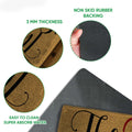 Close-up detail of the tan doormat surface, folded edge, and black rubber backing