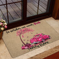 Pink ribbon breast cancer awareness doormat styled by a glass entry door with fall-inspired artwork