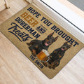 Doberman entryway rug displayed beside a door with two dogs and beer artwork
