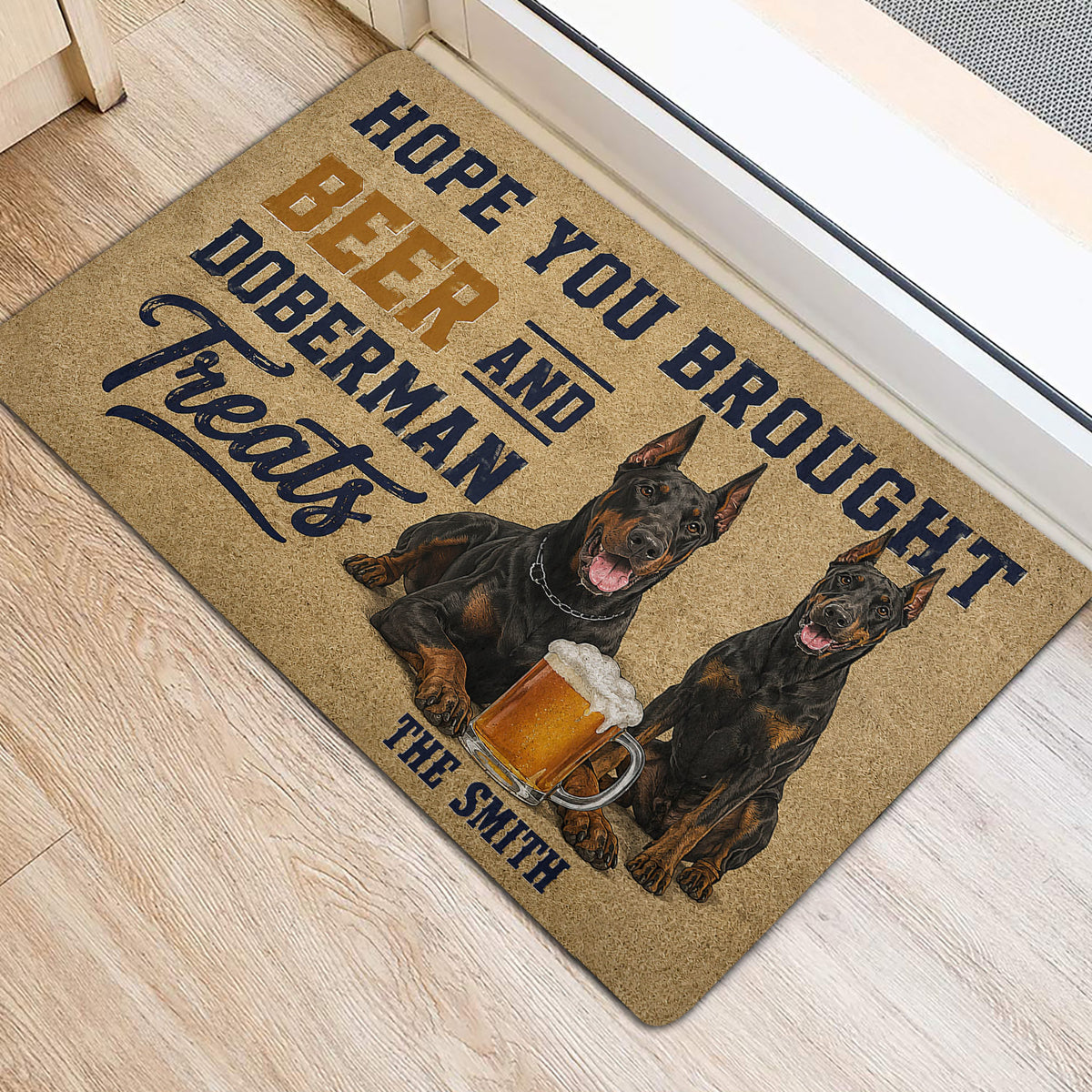 Doberman entryway rug displayed beside a door with two dogs and beer artwork