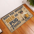 Pug beer-themed doormat displayed at an indoor doorway on a warm wood floor