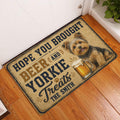 Yorkie beer-themed doormat displayed at an indoor entryway on a wood floor