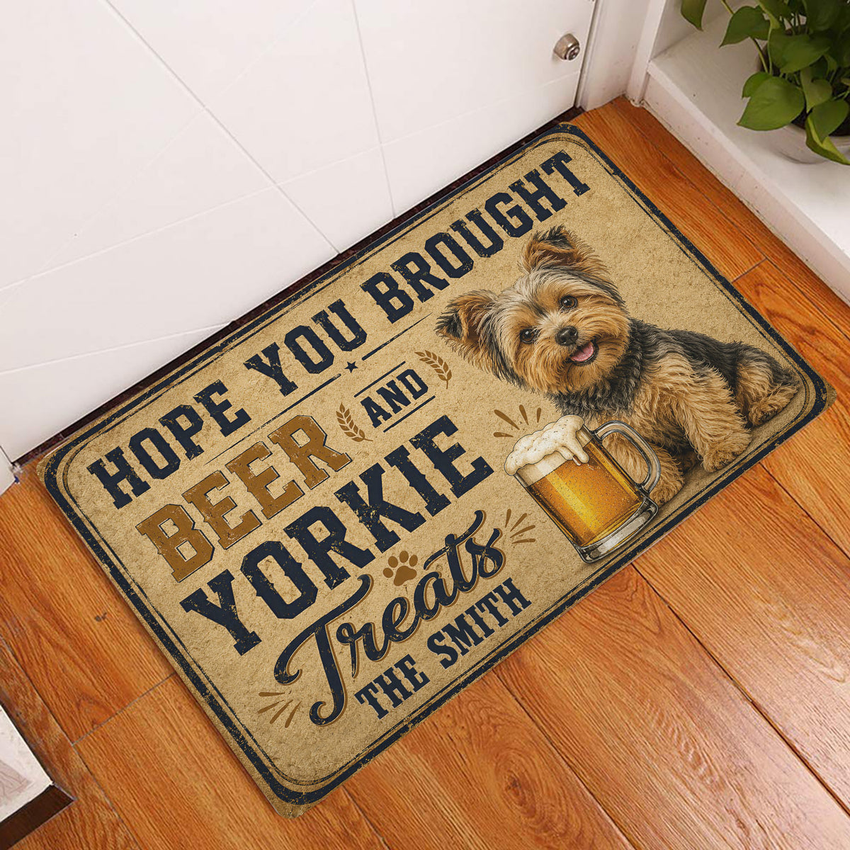 Yorkie beer-themed doormat displayed at an indoor entryway on a wood floor