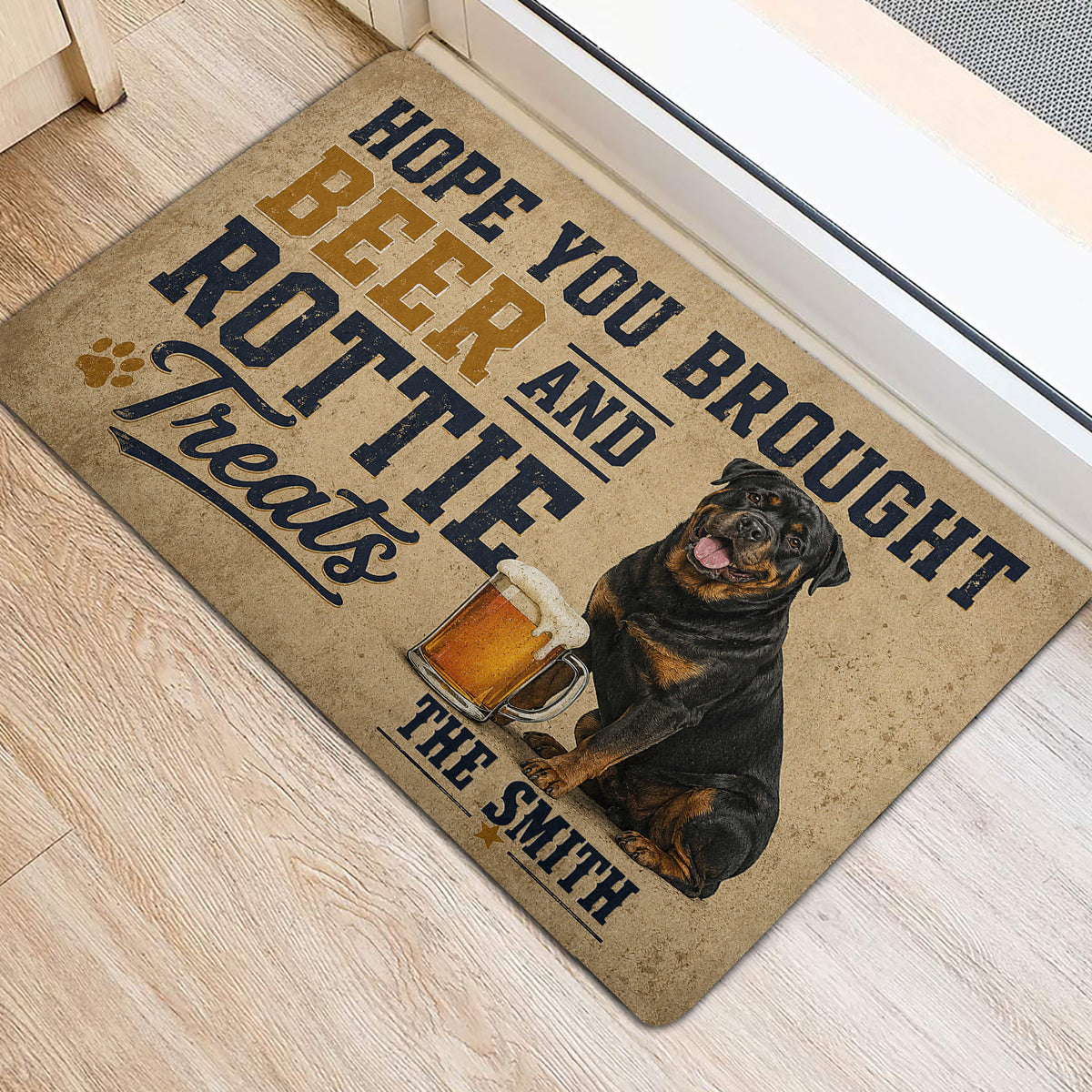 Rottweiler welcome doormat with beer mug artwork shown beside an interior doorway