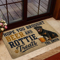 Rottweiler beer-themed door mat styled near a glass door and indoor entryway