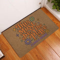 Hippie peace-themed doormat styled in an indoor entryway with colorful flowers and retro lettering