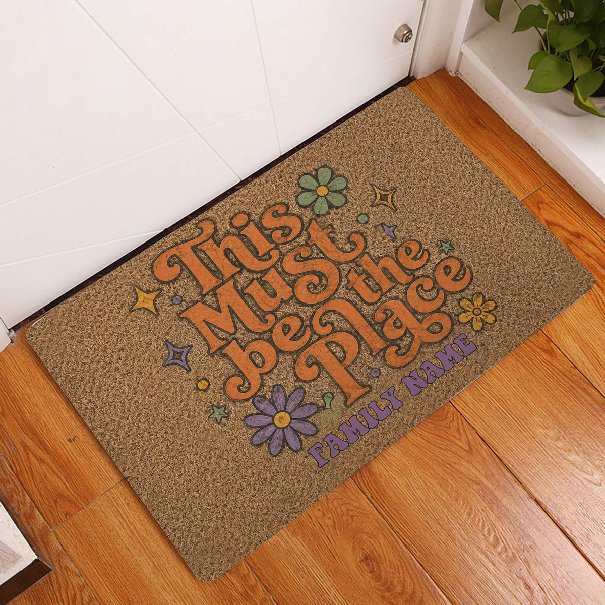 Hippie peace-themed doormat styled in an indoor entryway with colorful flowers and retro lettering