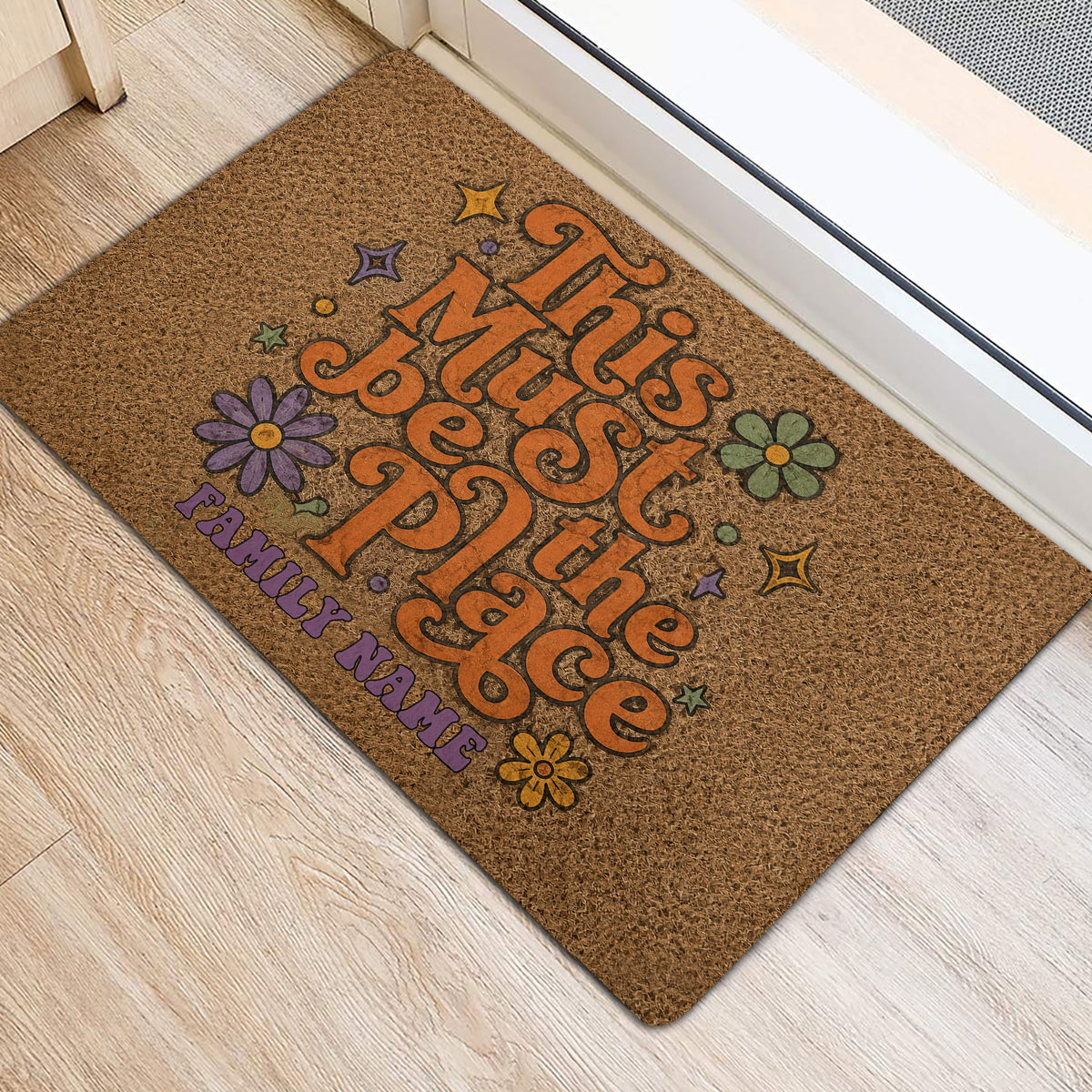 Hippie entryway rug displayed near a door with colorful flowers, stars, and peace-inspired artwork