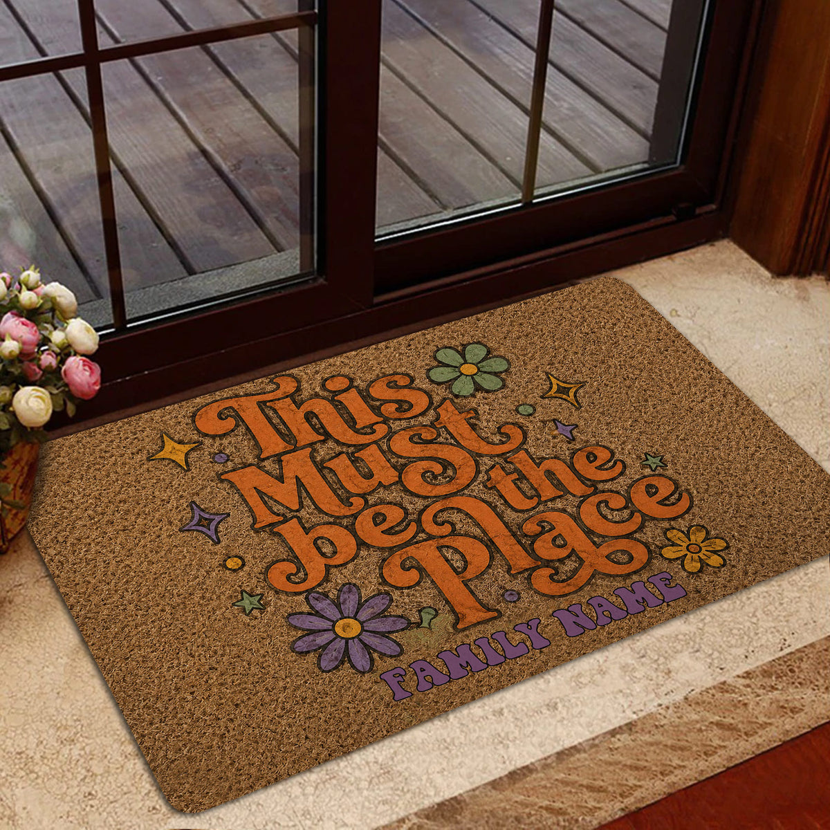 Hippie doormat presented at a home entrance with colorful floral artwork and retro peace lettering