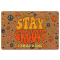 Groovy hippie doormat with colorful daisies, peace symbols, and bold retro lettering