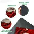 Close-up detail of the Christmas pig doormat showing its printed felt surface and black rubber backing
