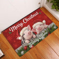 Christmas pig entryway rug displayed on a wood floor beside a white door with festive red artwork