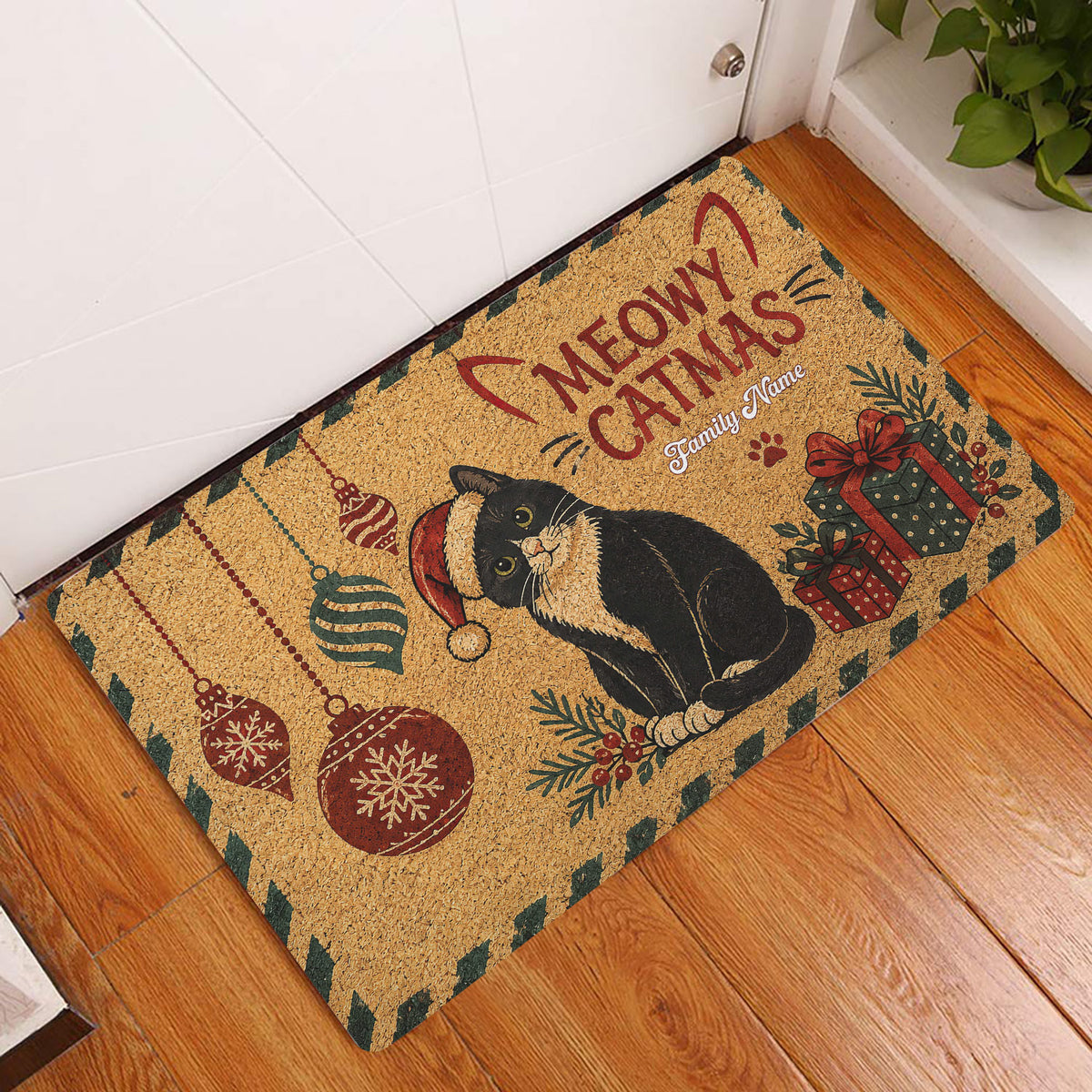 Christmas tuxedo cat entryway mat displayed beside a white door on wood flooring