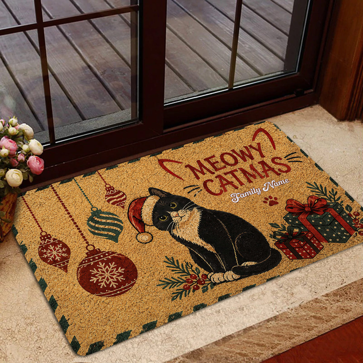 Festive tuxedo cat doormat displayed near a glass door in a home entryway