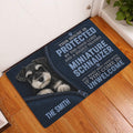 Miniature Schnauzer entryway doormat displayed on a warm wood floor beside a white door
