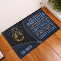 Rottweiler doormat styled at a home entrance on hardwood flooring with dark blue artwork