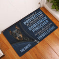 Doberman Pinscher doormat displayed on a wood floor beside an indoor doorway