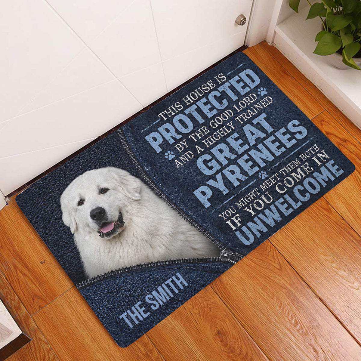 Great Pyrenees doormat displayed by a white entry door on a warm wood floor