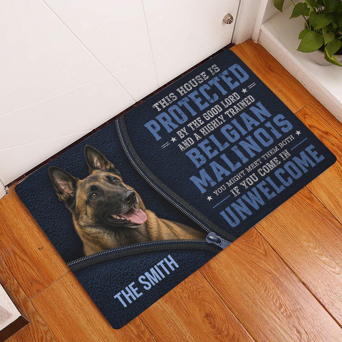Belgian Shepherd doormat styled at an indoor entryway beside a white door and warm wood flooring