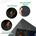 Close-up detail of dachshund doormat artwork and black rubber backing