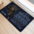Dachshund door mat placed at an interior doorway with a protective welcome design