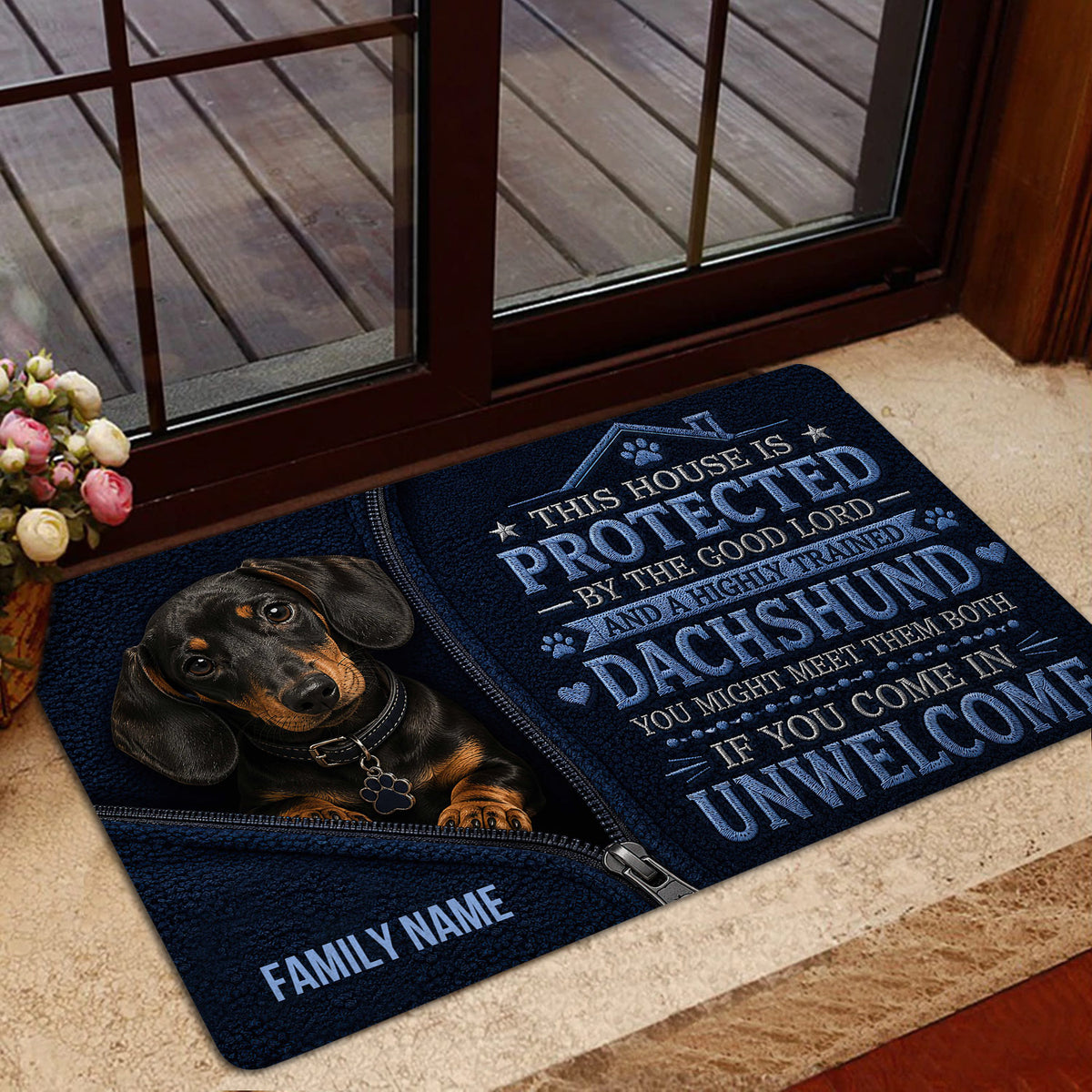 Dachshund doormat styled near a glass door in a warm home entryway