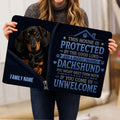 Dachshund doormat shown in a home setting with dark blue artwork and a protective message