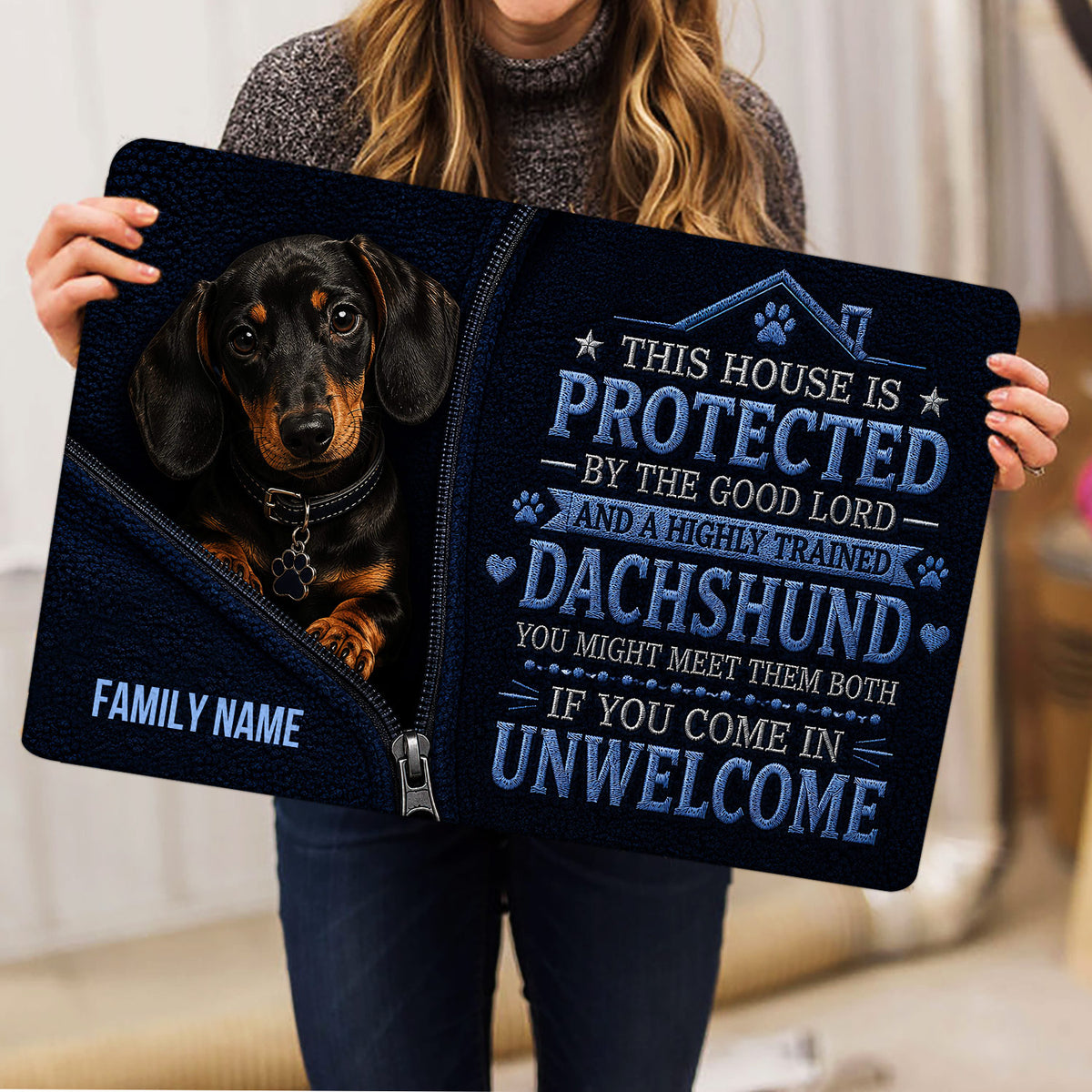 Dachshund doormat shown in a home setting with dark blue artwork and a protective message