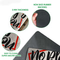 Close-up product detail showing the printed baseball doormat surface and black rubber backing