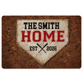 Vintage baseball doormat featuring a home plate design, crossed bats, baseball artwork, and bold red lettering