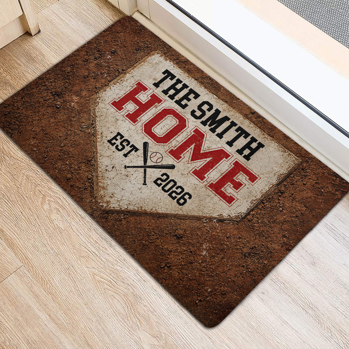 Baseball-themed door mat staged at an entryway with a distressed home plate and crossed bat design