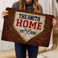 Baseball doormat held indoors, displaying vintage home plate artwork with crossed bats and red lettering