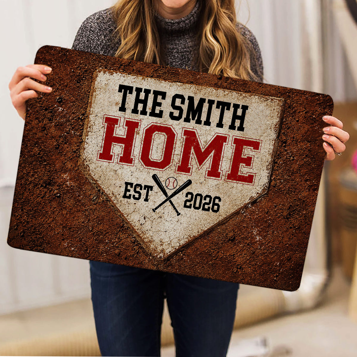 Baseball doormat held indoors, displaying vintage home plate artwork with crossed bats and red lettering