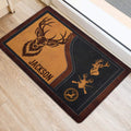 Deer hunting door mat positioned by a doorway, showing rustic brown and black artwork