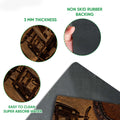 Close-up feature view of tractor doormat artwork with textured surface and black rubber backing