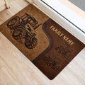 Rustic tractor door mat positioned near an entry door, featuring large tractor artwork and brown tones