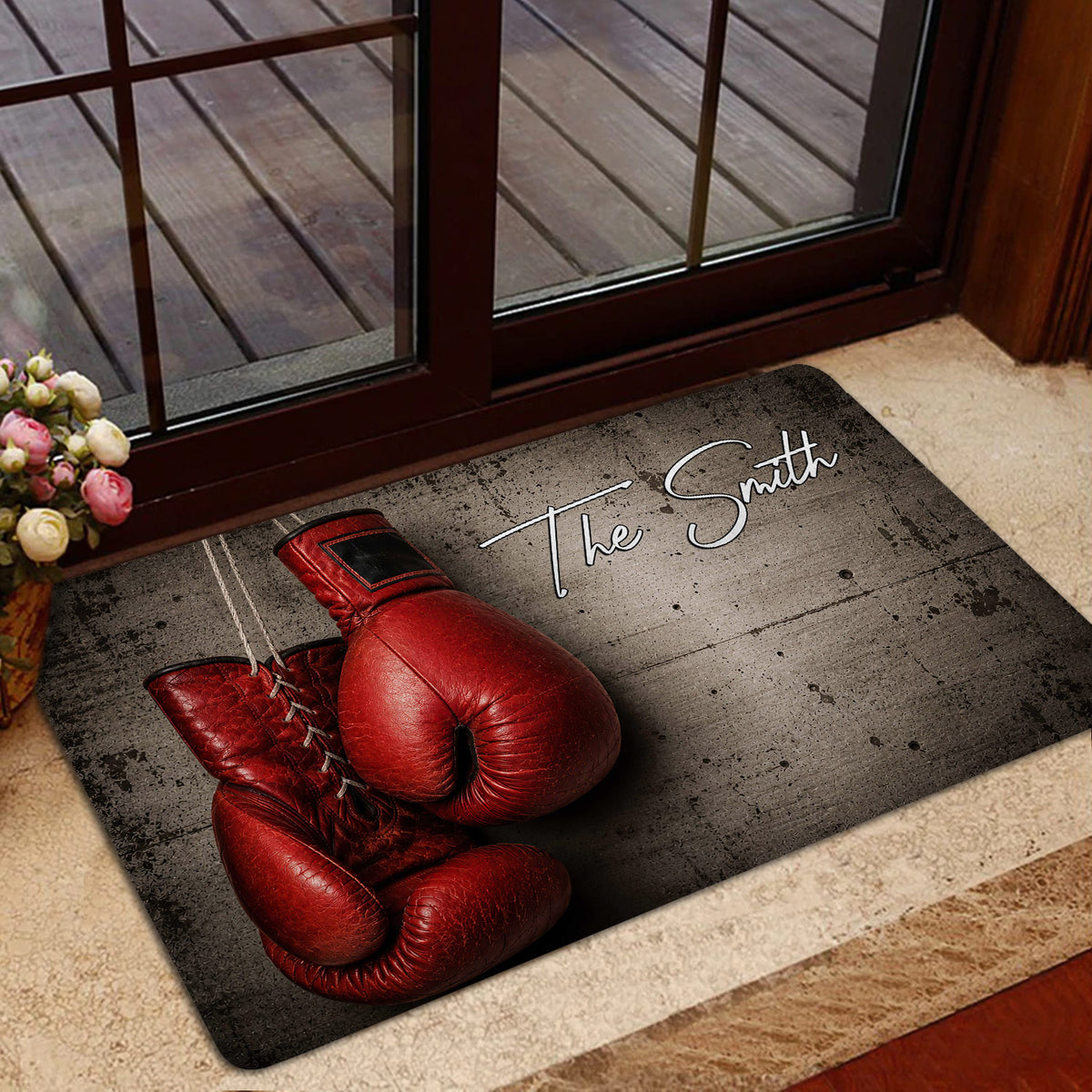 Boxing-themed doormat styled at a glass doorway with red gloves and script lettering