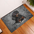 Dachshund entryway rug displayed beside a white door on a warm wood floor