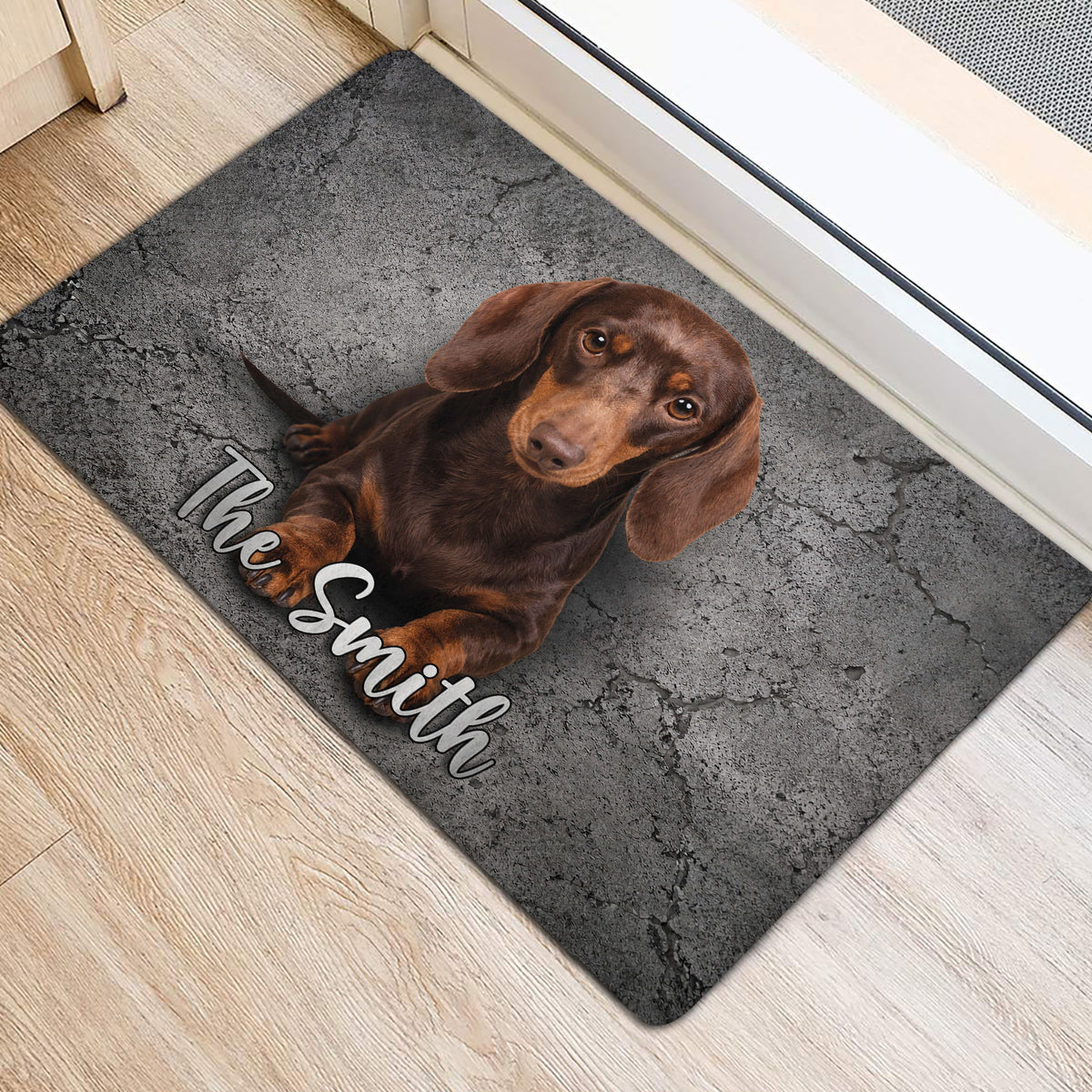 Brown dachshund doormat styled at an indoor entrance with light wood flooring