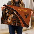 Person holding a rustic hunting doormat with a whitetail deer, forest scene, and leather-inspired border