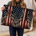 Deer and American flag hunting doormat held up for a detailed product view