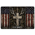Hunting doormat with deer antlers, bow, rustic woodland artwork, distressed American flag border, and sample lettering