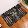 Rustic hunting doormat with deer antlers, bow, and distressed flag design displayed at an indoor entryway