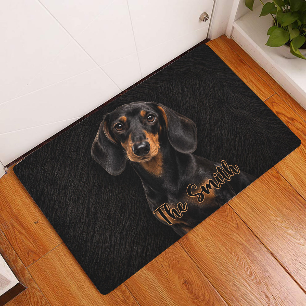 Dachshund doormat displayed at an indoor entryway on a warm wood floor