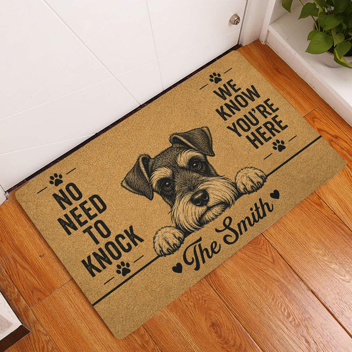 Miniature Schnauzer doormat displayed by a white door on a warm wood floor in a home entryway